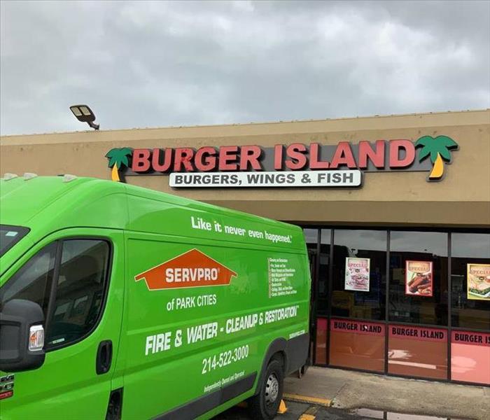 A SERVPRO Van waiting to begin its work outside a local burger place.