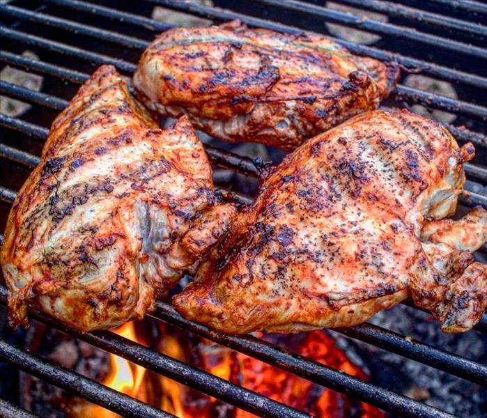 Chicken cooking on a grill