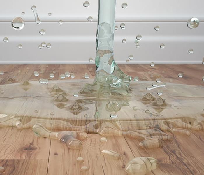 Water falling on to hardwood flooring.